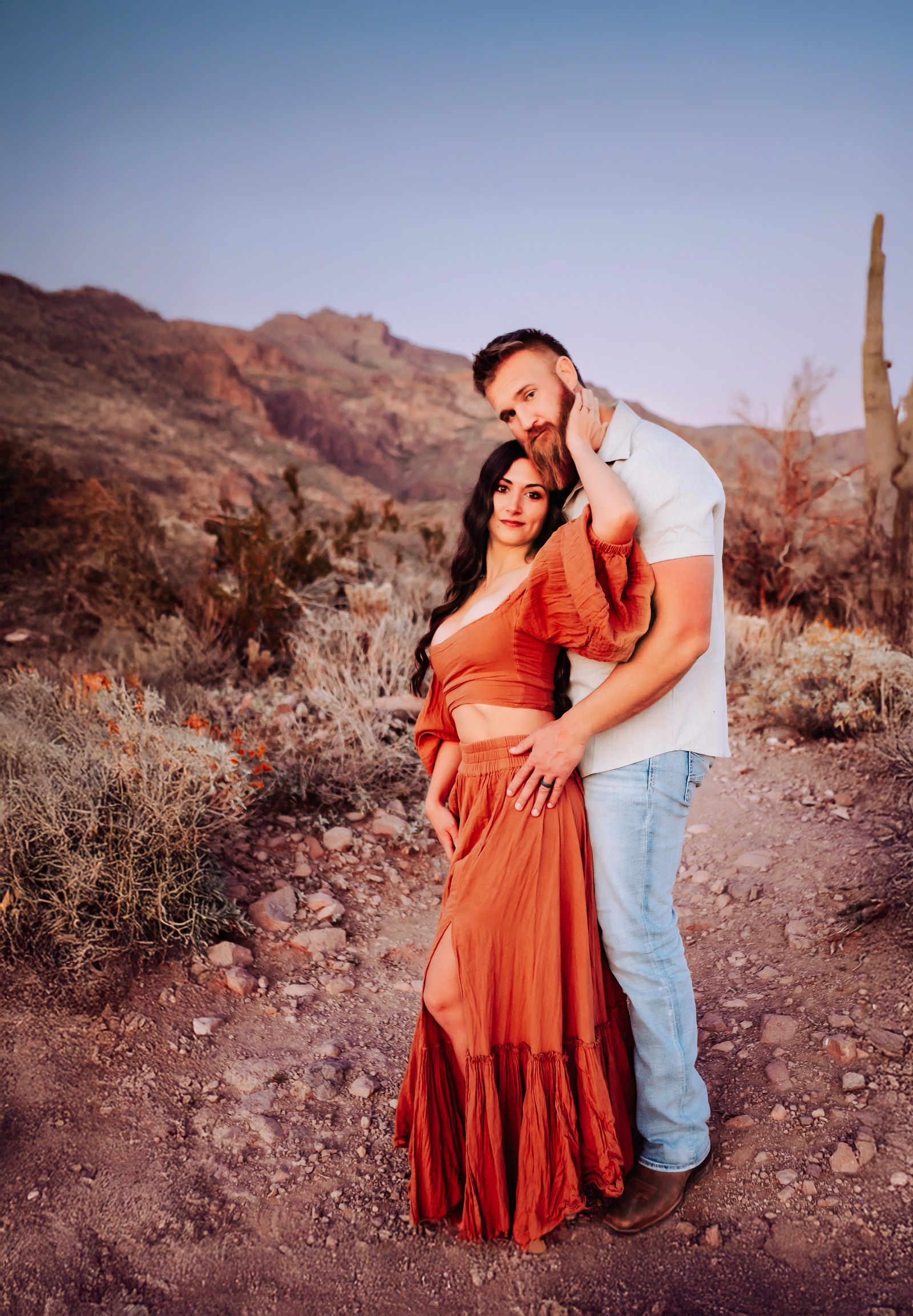 Jason and Kiana, founders of United by Design, in the Arizona desert at golden hour